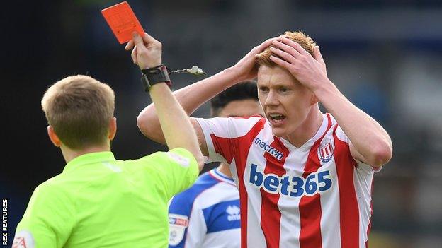 Stoke City's Sam Clucas is shown a straight red card
