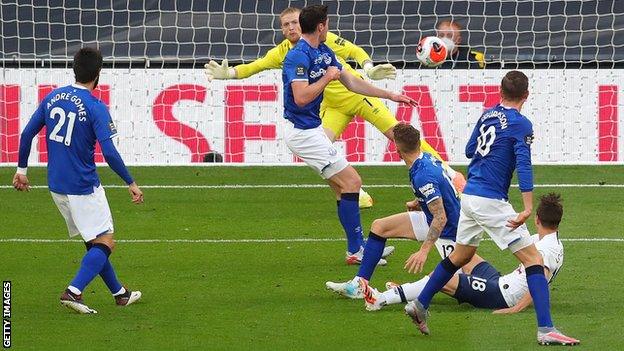 Giovani lo Celso's effort deflects in off Everton defender Michael Keane