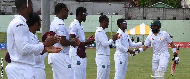 Misbah-ul-Haq is given a guard of honour by the West Indies fielders