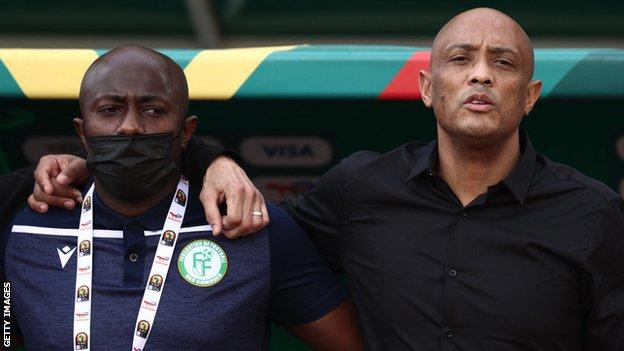 Comoros coach Amir Abdou (right) in the dugout