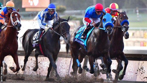 Jockey Abel Cedillo rides Mongolian Groom (second from right) at the Breeders' Cup