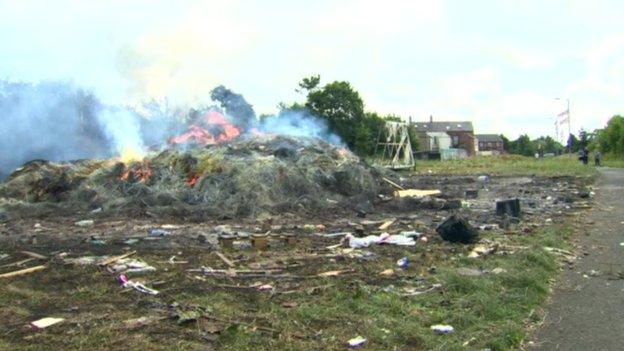 The aftermath of the bonfire in east Belfast, which is on land owned by the Department of Regional Development