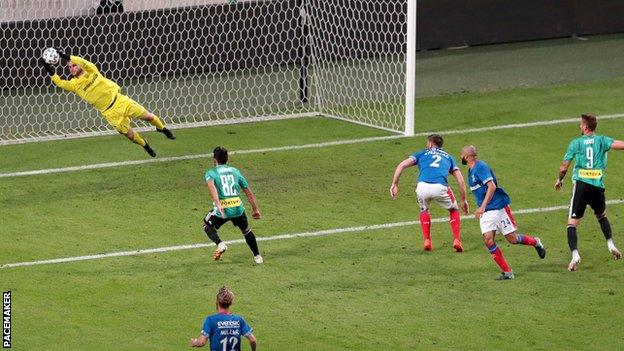 Linfield keeper Chris Johns denies Legia at the Polish Army Stadium