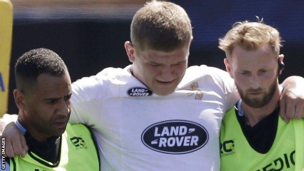 Wasps' Jack Willis helped off the pitch after suffering a serious knee injury against Saracens on Saturday.