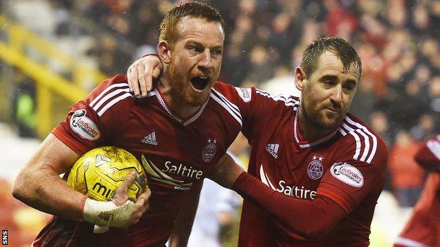 Adam Rooney and Niall McGinn celebrate Aberdeen's late equaliser