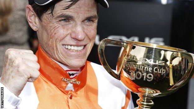 Jockey Craig Williams celebrates after his first Melbourne Cup victory