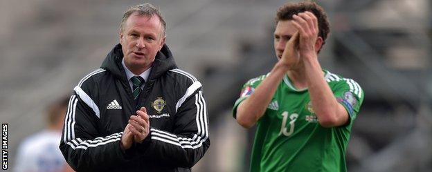 Michael O'Neill and Northern Ireland midfielder Corey Evans