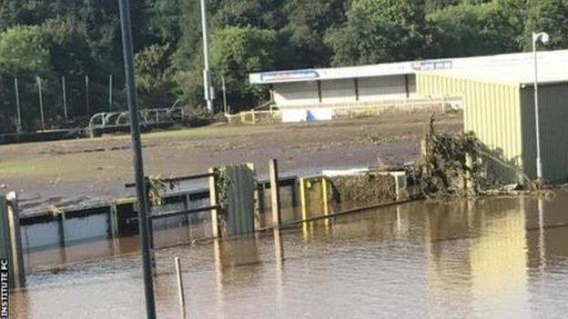 The flood waters begin to recede at the Riverside Stadium but the pitch is destroyed