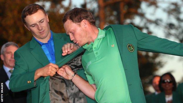 Jordan Spieth helps Danny Willett put the Green Jacket on