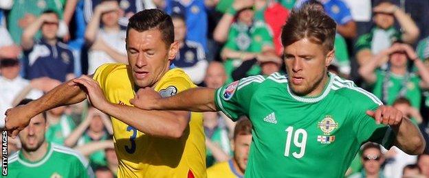 Jamie Ward (right) in action for Northern Ireland