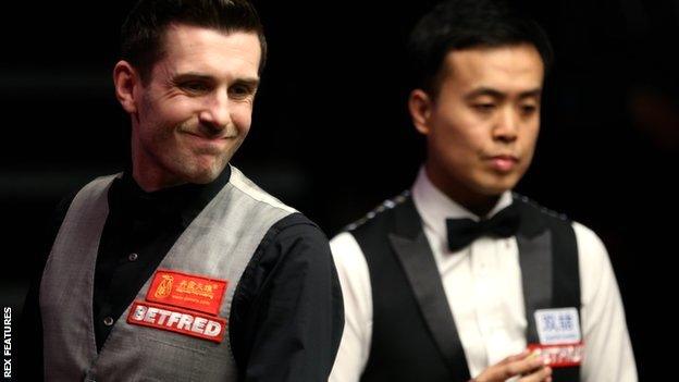 Mark Selby (left) and Marco Fu