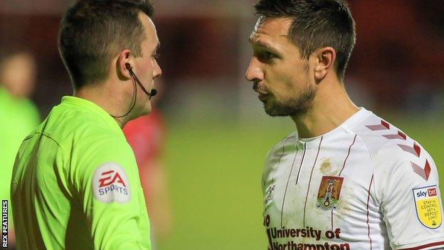 Joe Martin (right) remonstrates with a match official after being sent off