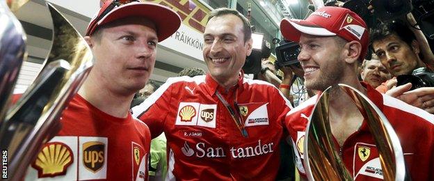 Sebastian Vettel and Kimi Raikkonen celebrate finishing first and third at the Singapore Grand Prix