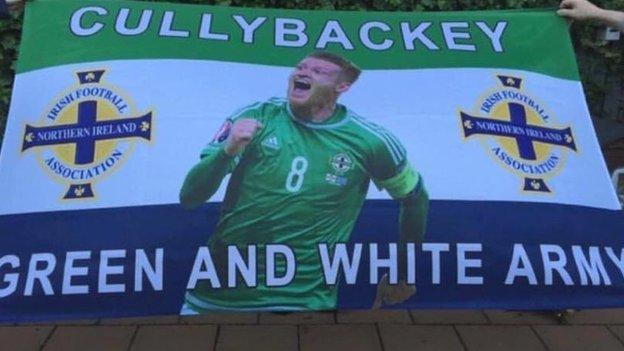 Northern Ireland fans from Cullybackey show their support for NI's number eight Steven Davis