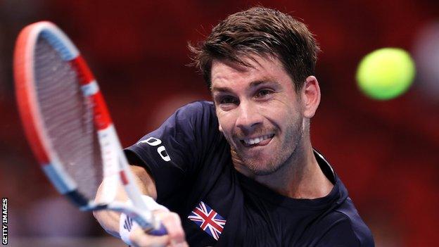 Cameron Norrie returns a ball at the ATP Cup