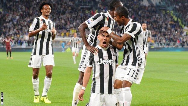 Paulo Dybala celebrates scoring against Torino for Juventus