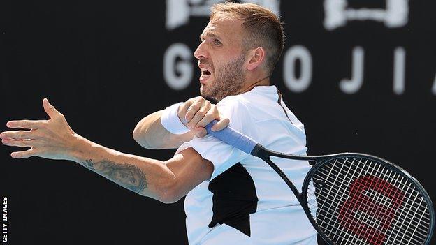 Dan Evans makes a forehand