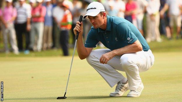 Justin Rose lines up a putt at the Hong Kong Open