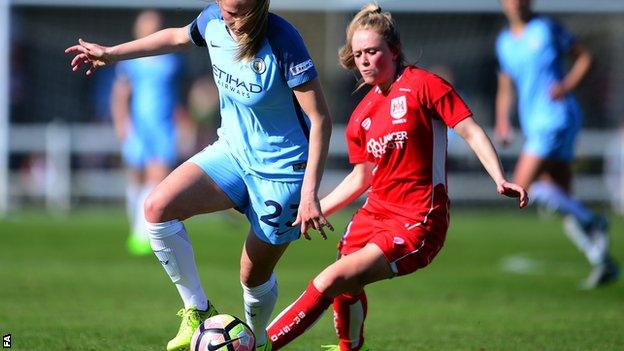 Abbie McManus of Manchester City Women (left) looks to break past Millie Farrow of Bristol City Women