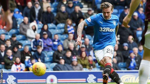 Jason Cummings knocks in the opening goal at Ibrox