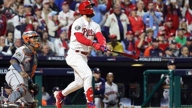 Bryce Harper hits a home run for the Philadelphia Phillies, watched by Houston Astros catcher Martin Maldonado