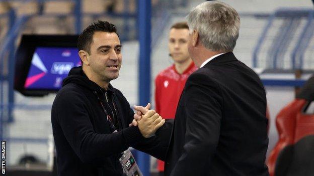 Xavi and Carlo Ancelotti