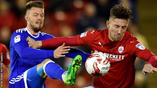 Cardiff's Anthony Pilkington in action against Barnsley's Angus MacDonald