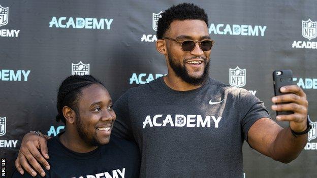 Christian Scotland-Williamson with a student at the NFL Academy