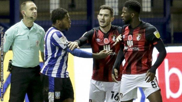 Sheffield Wednesday's Kadeem Harris (left) was sent off for a challenge on Jefferson Lerma (right) shortly after the alleged biting incident