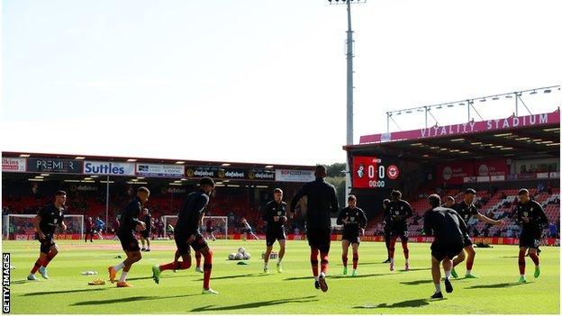 Bournemouth players warm up before a game