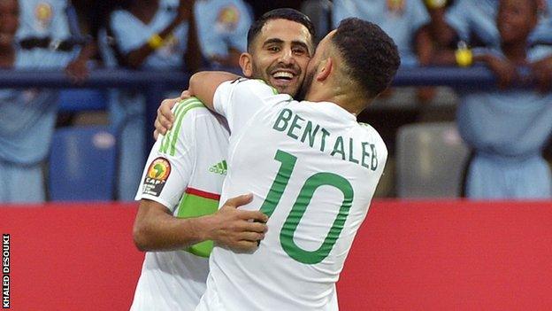 Riyad Mahrez is congratulated by Nabil Bentaleb