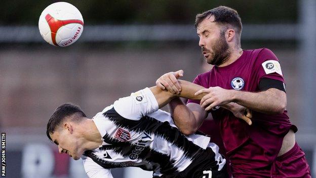 Flint Town's Harry Owen and Steve Tomassen of Airbus in action