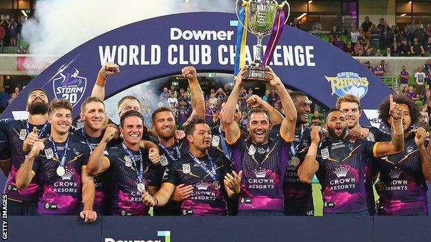 Cameron Smith holds the World Club Challenge trophy aloft