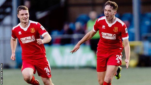 Newtown's George Hughes celebrates after his winner against Barry