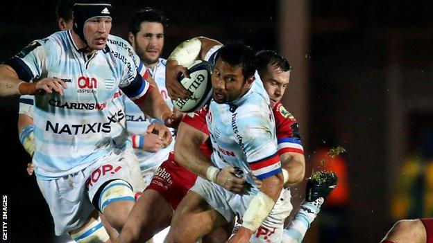 Casey Laulala is tackled by Scarlets' Gareth Davies