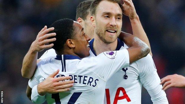 Kyle Walker-Peters celebrates with Christian Eriksen