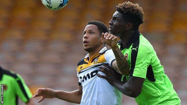 Nathan Tyson holds of Kortney Hause of Wolverhampton Wanderers while on trial with Port Vale