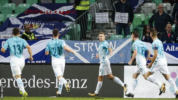 Roman Bezjak (centre) changed the game with two second-half goals for Slovenia