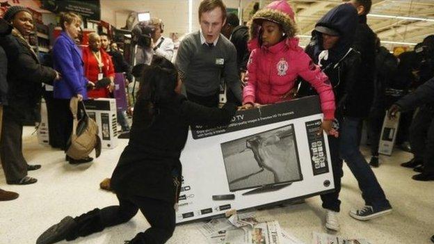 Shoppers fight over a TV in a supermarket