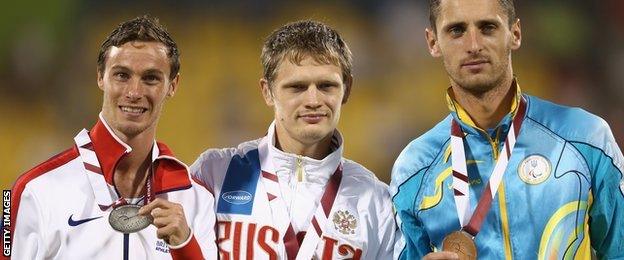 Britain's Paul Blake with Russian T36 400m gold medallist Yevgeny Shevetcov