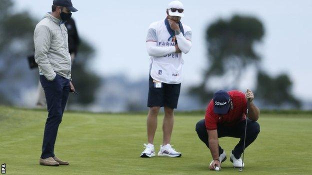 Patrick Reed replacing his ball during Sunday's final round