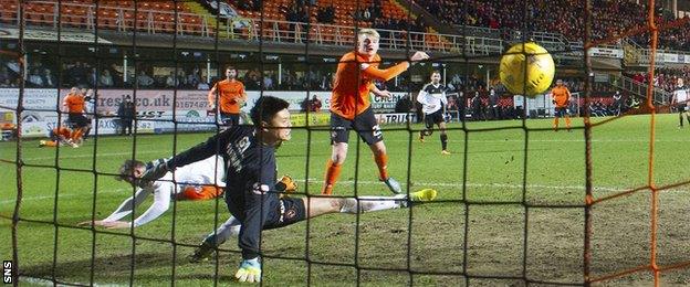 Simon Church's header beats Dundee United goalkeeper Eiji Kawashima