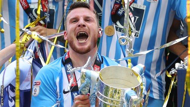 Chris Stokes celebrates after helping Coventry City get promoted