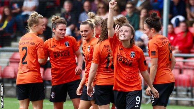 Glasgow City's Kirsty Howat (right) celebrates one of her two goals against Hibs