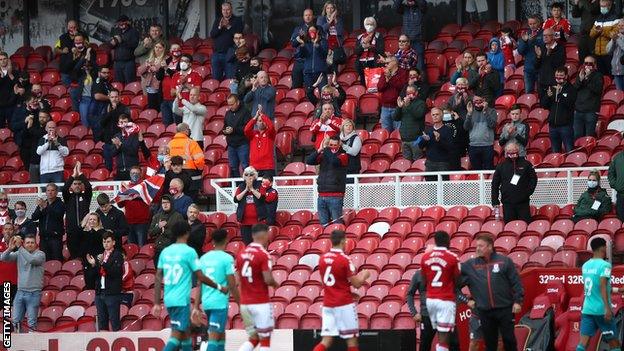 Middlesbrough fans applaud the players off the pitch after their Championship match against Bournemouth that saw 1,000 socially-distanced supporters attend