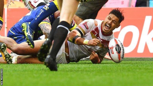 Brayden Wiliame of Catalan Dragons celebrates as he scores a try