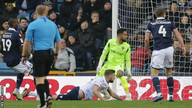 Mark Beevers heads in Bolton's opener at Millwall.