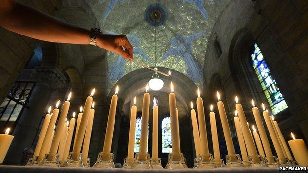 Candles at a tribute for Tunisia victims at St Anne's cathedral in Belfast