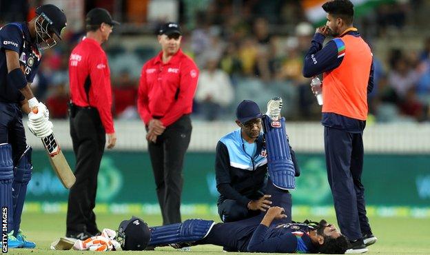 India's Ravindra Jadeja receives treatment for a hamstring injury in the first T20 against Australia