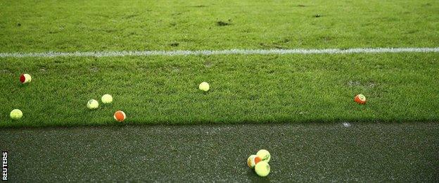 Tennis balls on the pitch at the Mercedes-Benz Arena